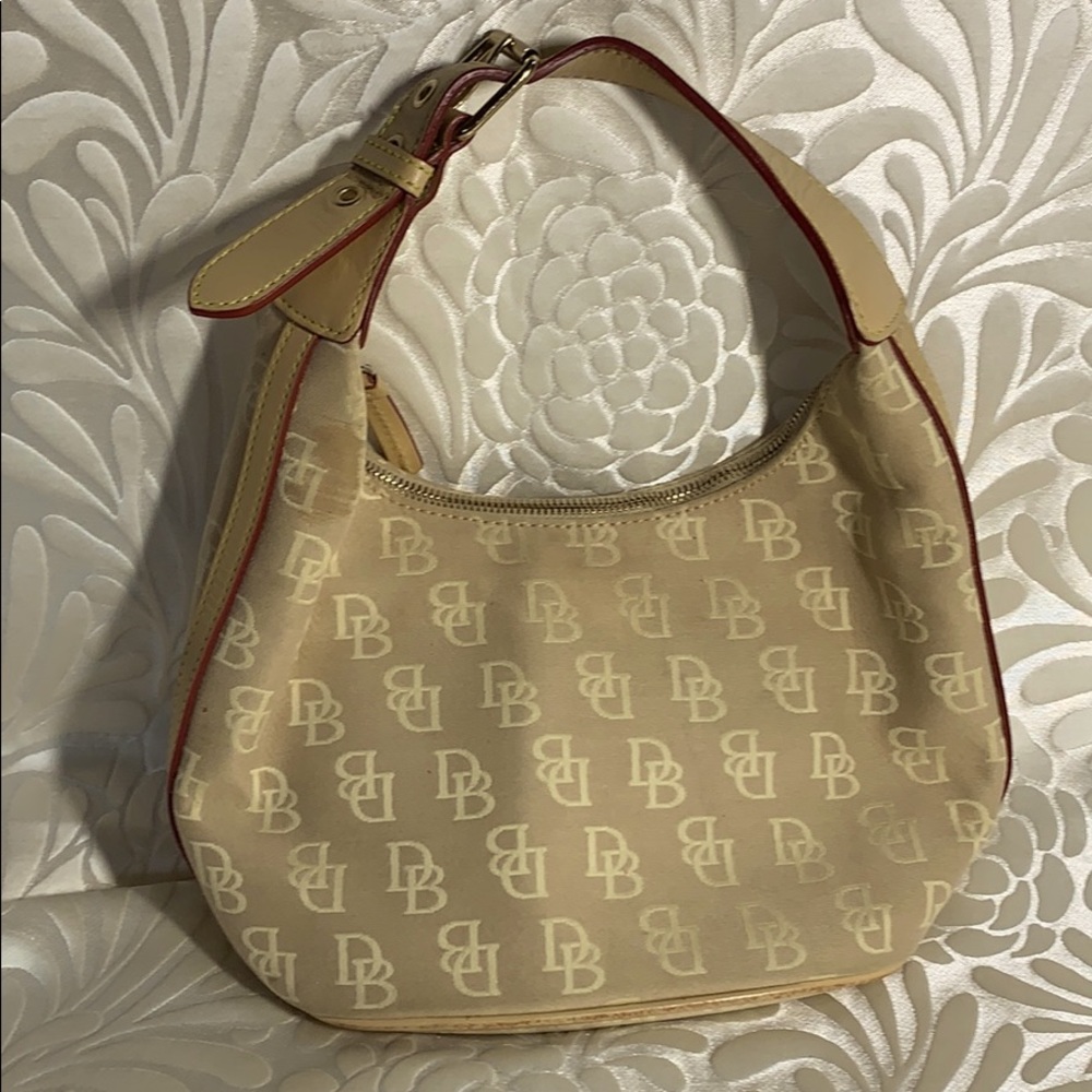 Dooney small light tan monogram bucket bag